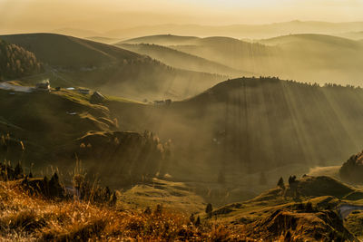 Scenic view of mountains against sky during sunset