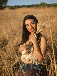 Young woman standing on field