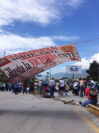 People at town square against sky