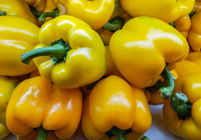 Close-up of yellow bell peppers for sale in market