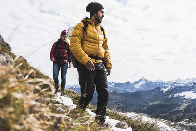 Germany, bavaria, oberstdorf, two hikers walking in alpine scenery