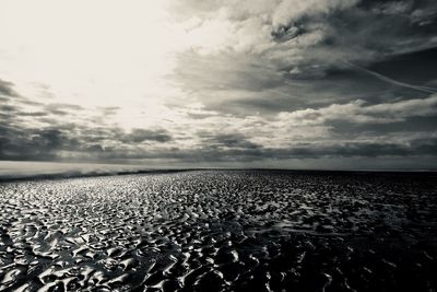 Surface level of beach against sky