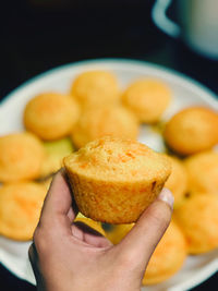 Close-up of hand holding ice cream