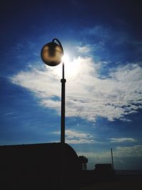 Low angle view of street light against sky