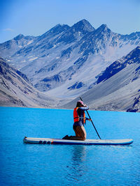 Man kayaking in lake