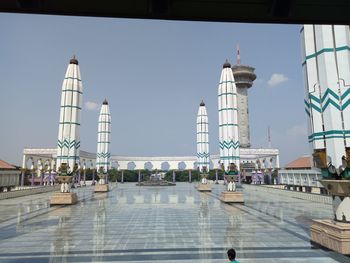 View of buildings in city against clear sky