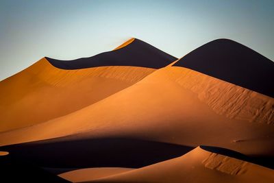 Scenic view of desert against clear sky