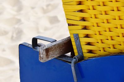 High angle view of yellow container against wall