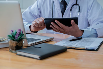 Man using laptop on table