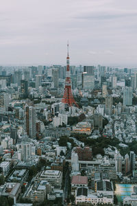 Day time view of tokyo with the tokyo tower in the middle.