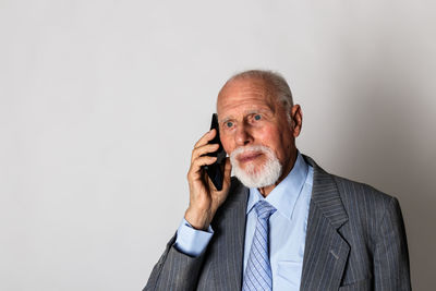 Low angle view of man using smart phone