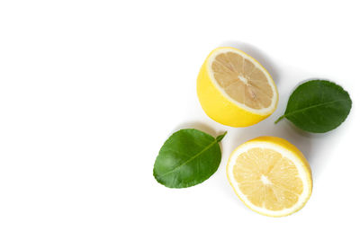 Close-up of lemon slice over white background