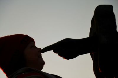 Cropped image of woman holding smart phone