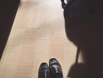 Low section of person standing on ground