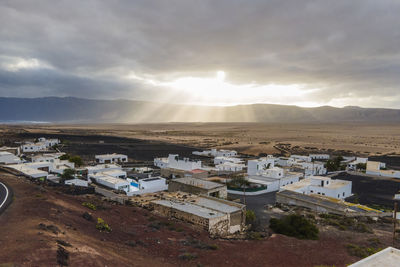 High angle view of townscape against sky during sunset