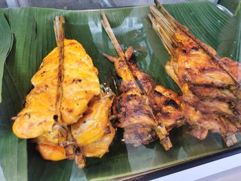 High angle view of fish on barbecue grill