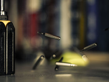 Close-up of machine part on table