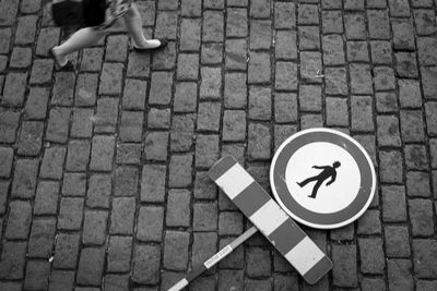 Low section of man walking on street