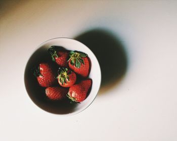 High angle view of strawberries in bowl on table