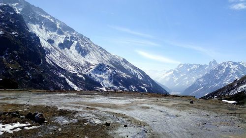 Scenic view of snowcapped mountains against sky