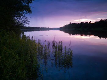 Scenic view of lake against sky during sunset