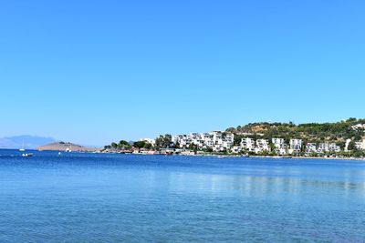 Scenic view of sea against clear blue sky