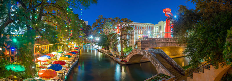 High angle view of illuminated buildings in city at night