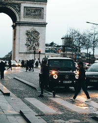 People walking on street in city
