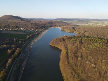 High angle view of river amidst landscape against sky