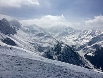 Scenic view of snowcapped mountains against sky