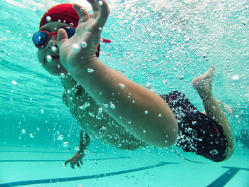 Man swimming in pool