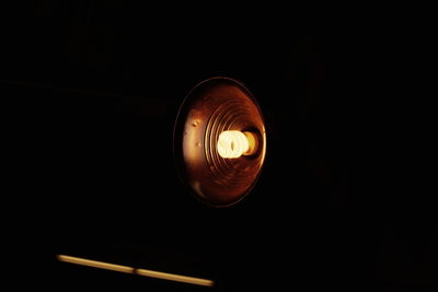 Low angle view of illuminated lamp