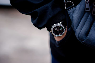 Close-up of man wearing wristwatch