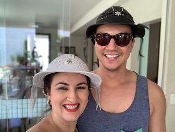 Portrait of smiling couple standing at home