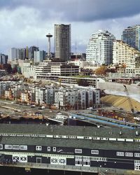 High angle view of buildings in city against sky