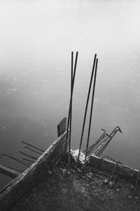 High angle view of abandoned ship in sea against sky