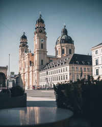 View of buildings in city against sky