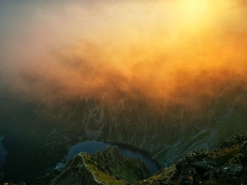 Hazy mountain peaks at sunrise. poland tatra mountains. red sunrise.