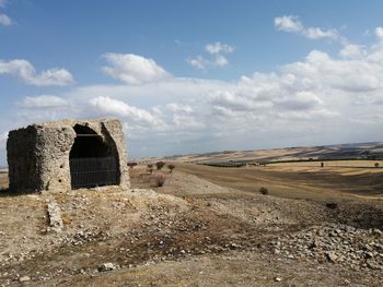 Built structure on desert against sky