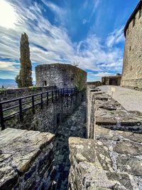 View of old ruin building against cloudy sky