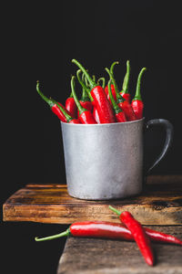 Close-up of red chili pepper against black background