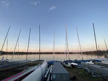 Sailboats in marina at sunset