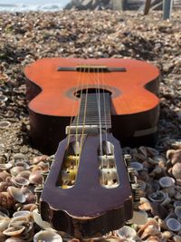 High angle view of guitar on beach