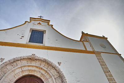 Low angle view of old building against sky