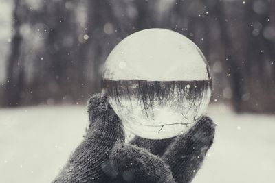 Close-up of man with reflection in water