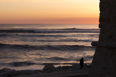 Scenic view of sea at sunset