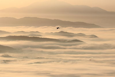 Fogs filled between the mountain ranges create a mysterious landscape.