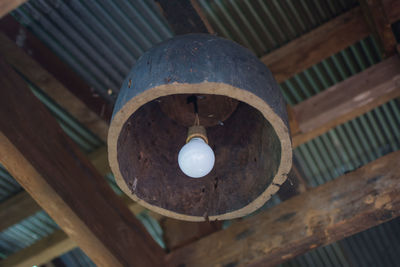 Low angle view of pendant light hanging from ceiling