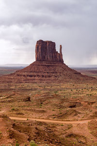 Rock formations on landscape against sky