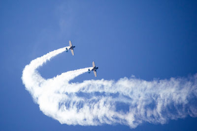 Low angle view of airplane flying in sky